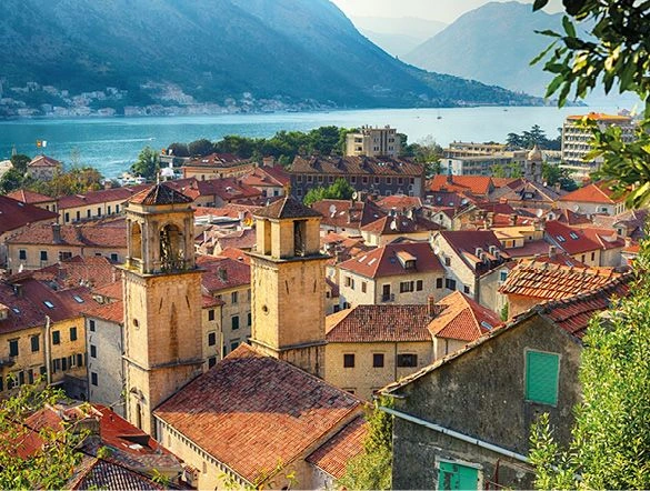 Yellow buildings overlooking the coastal town of Kotor in Montenegro along the Adriatic