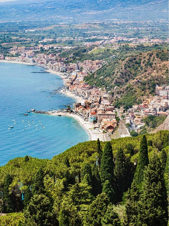 View across Giardini Naxos Bay over to Mount Etna