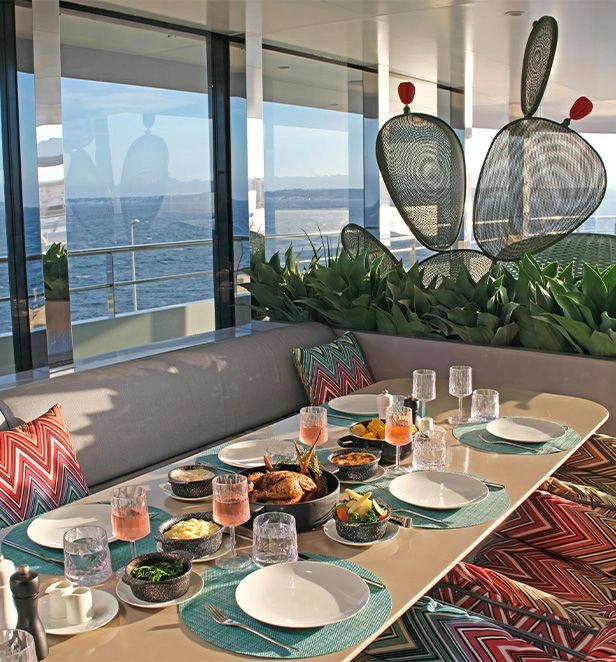 Aqua Café table set with shared dishes and ocean views