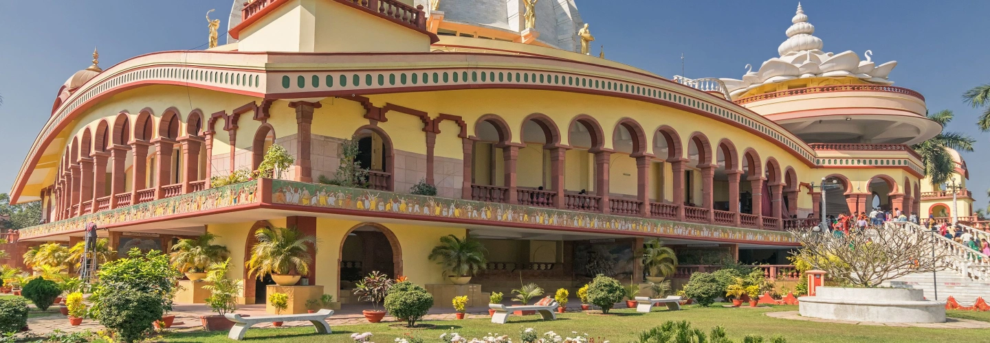 Temple with a white dome and gold finial in Mayapur