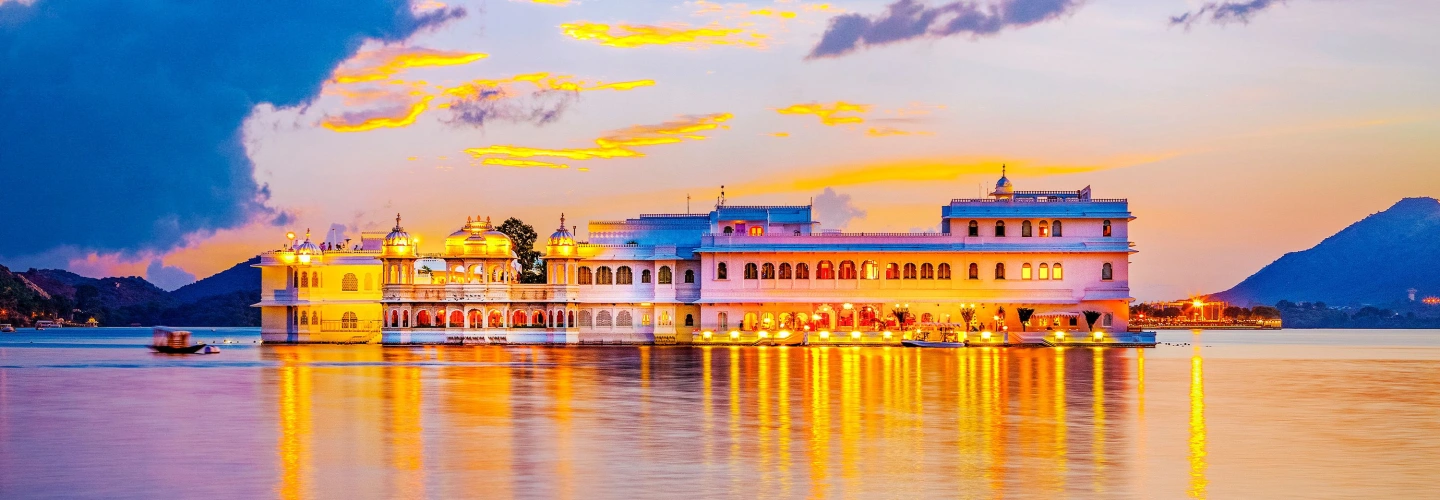 Taj Lake Palace illuminated at sunset on Lake Pichola