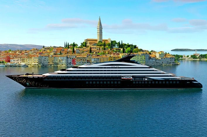 Scenic Ikon sailing past Rovinj’s waterfront in Croatia