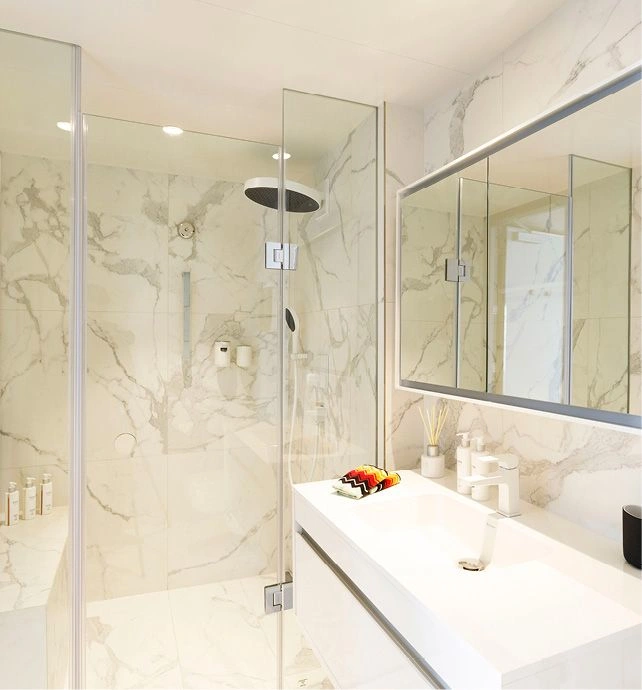 A white marble bathroom with luxurious ESPA toiletries and Missoni towels on board an Emerald Cruises yacht