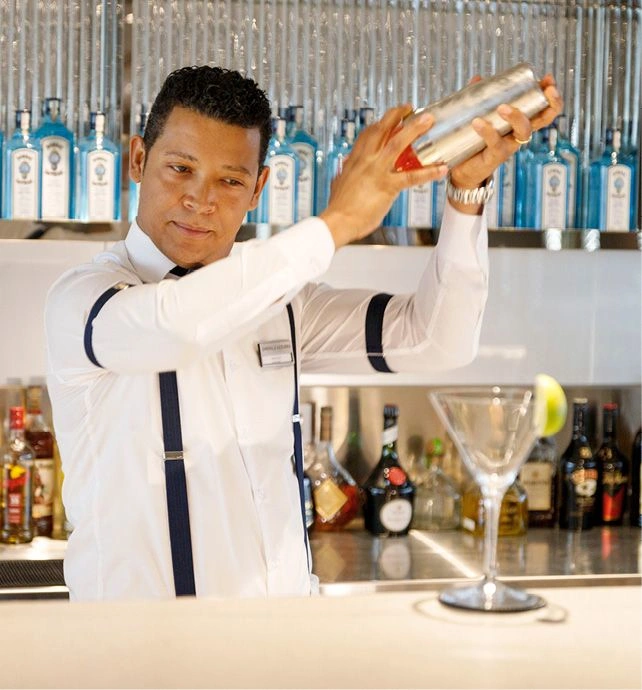 A man mixing a cocktail
