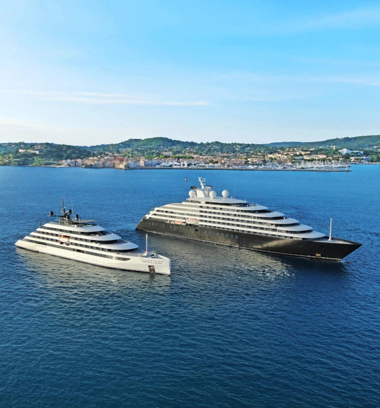 Scenic Eclipse and Emerald Sakara Star-Ships sailing alongside one another. 