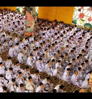Worshippers at the Cao Dai Temple, Tan Chau, Vietnam