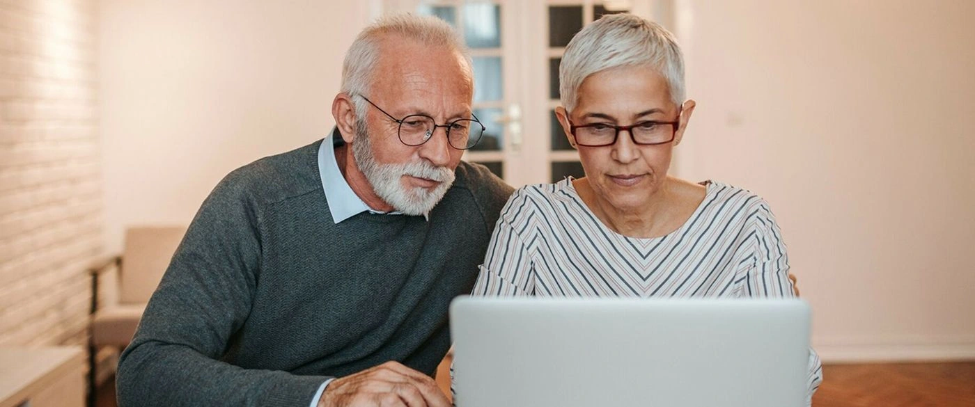 Couple sitting with laptop FAQs