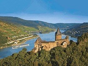 Scenic Crystal cruising past a castle and green hills on the Rhine Valley, Germany