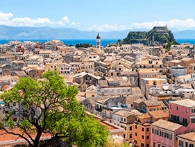 The skyline of Corfu, full of traditional houses in a vibrant sunny setting