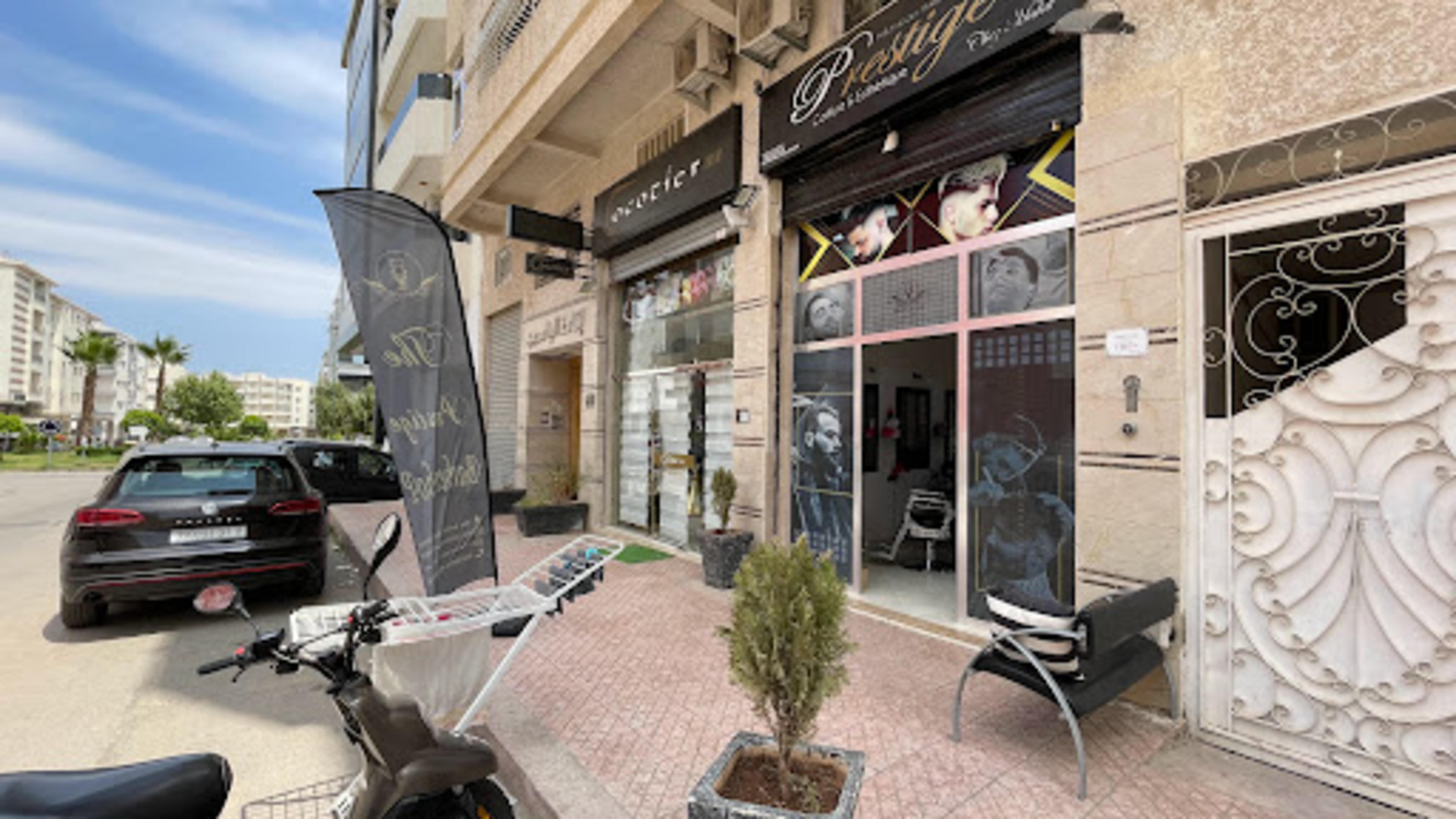 The prestige barbershop - logo