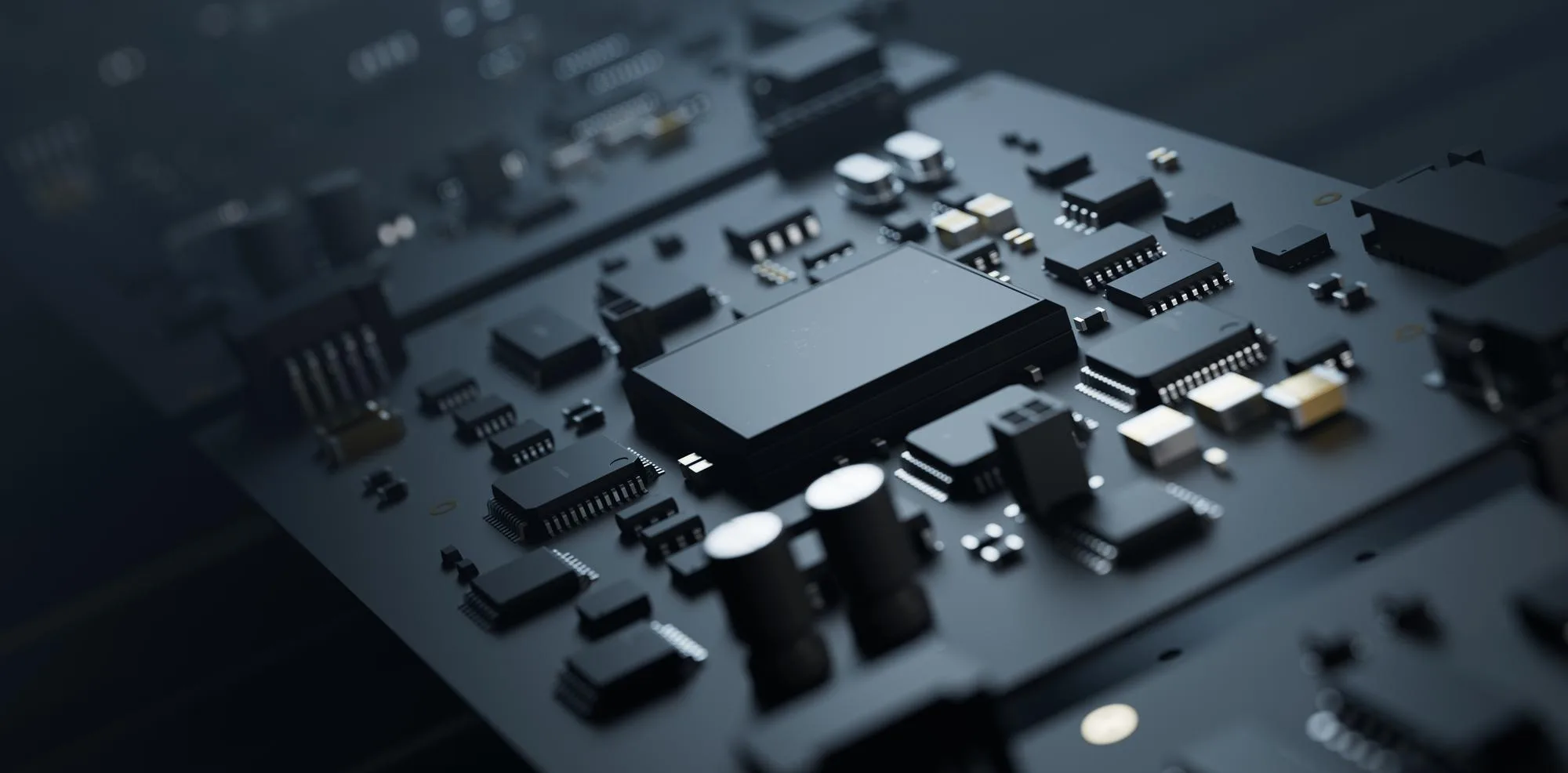 Close-up view of a black printed circuit board populated with microchips, capacitors, and resistors