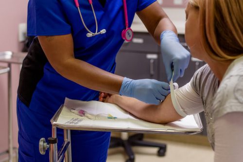 RN prepares to deliver patient care.