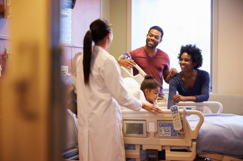 FNP talking to a family in a hospital.
