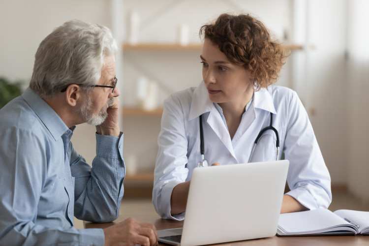 A psychiatric mental health nurse practitioner is discussing a treatment plan with a patient.