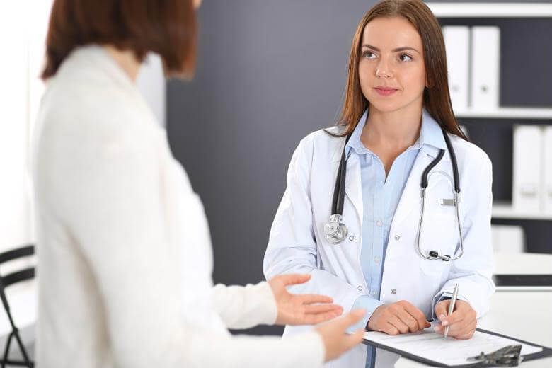 Family Nurse Practitioner speaking with colleague