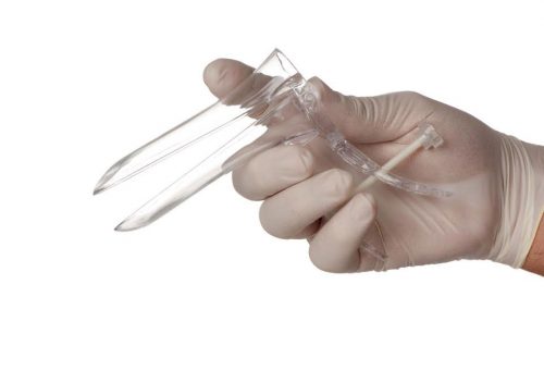 A hand in surgical glove holding a gynecological device
