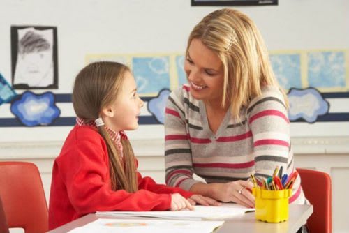 An elementary school counselor helps a student identify her interests and strengths.