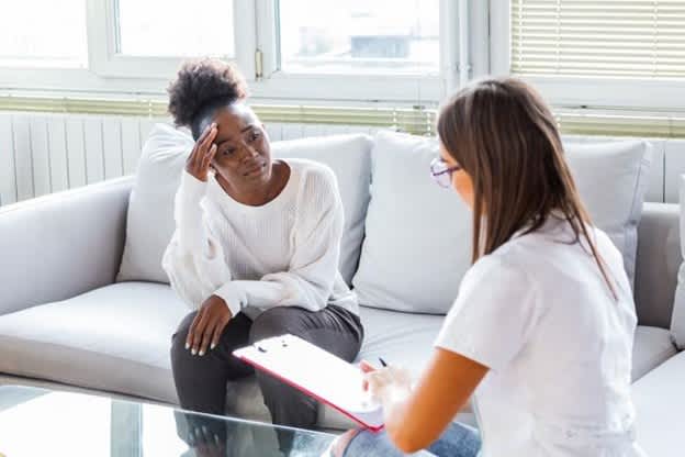 A crisis counselor speaks with a client.