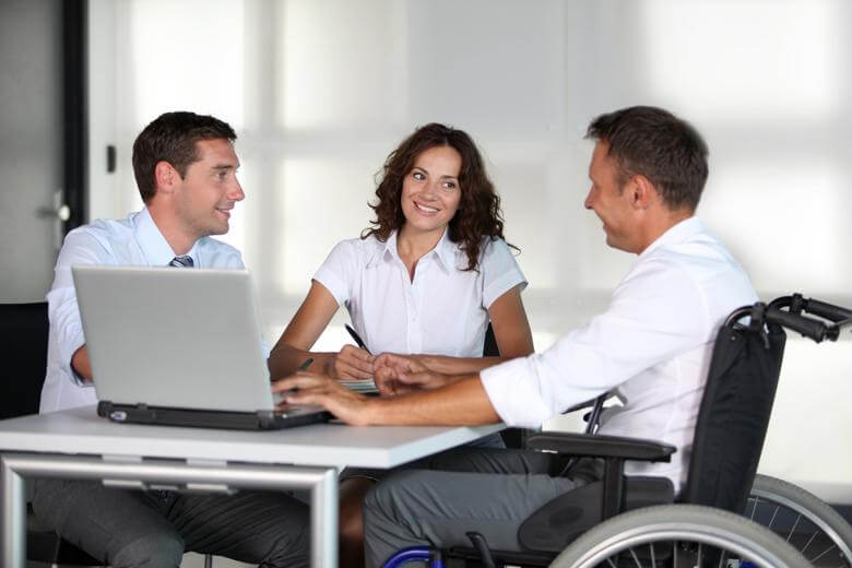 A rehabilitation counselor speaks with clients about employment opportunities.
