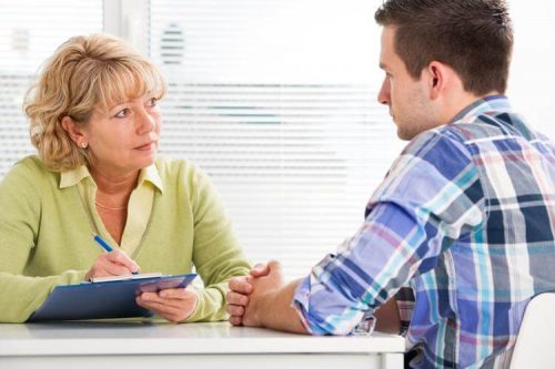 High school counselor with student.