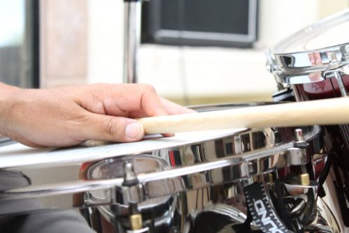 Percussionist’s hand rested on drum.