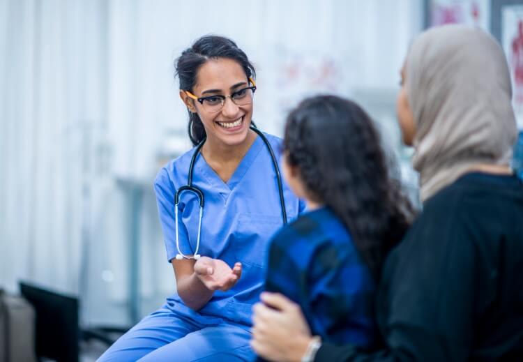 A family nurse practitioner meets with a mother and her child.