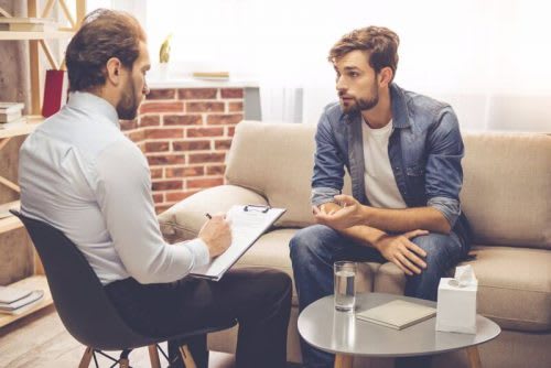 Male counselor assisting male client.
