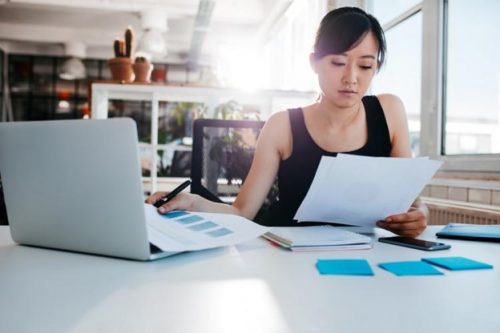 An organizational development consultant looks through employee data.