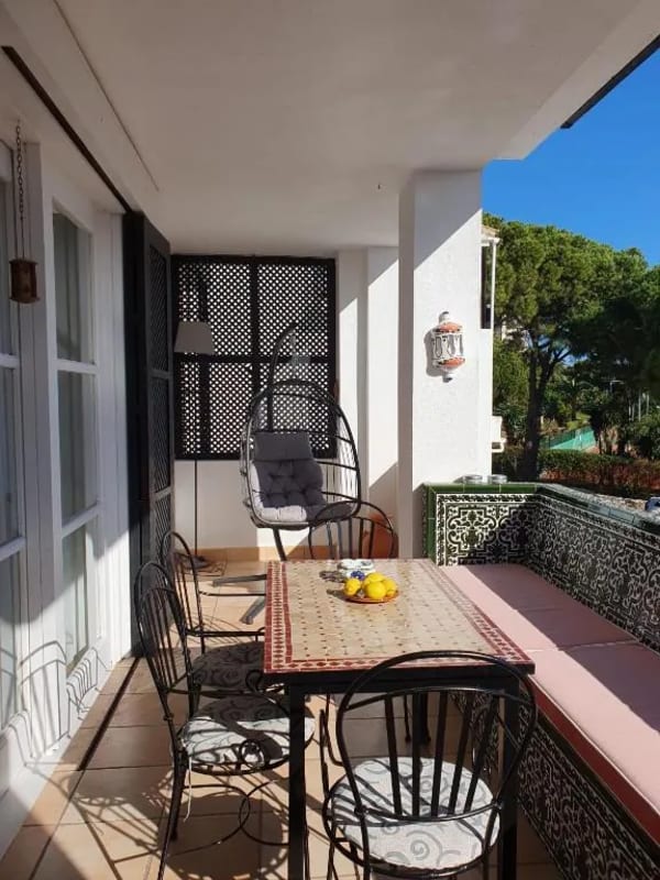 Jardines de las Golondrinas - Charming terrace nook with a stylish hanging egg chair and a complete outdoor dining set