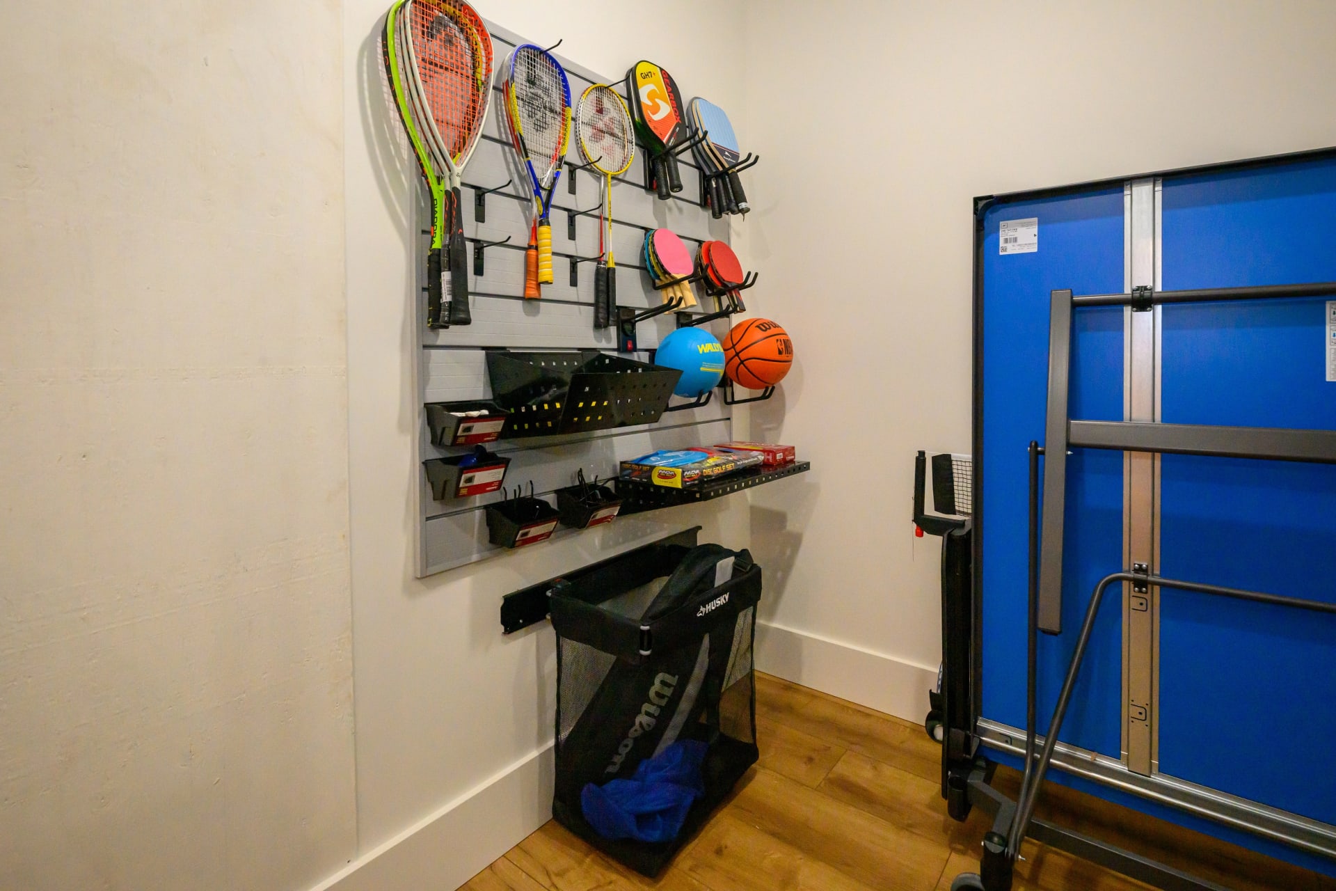 Sports equipment storage with rackets and gear