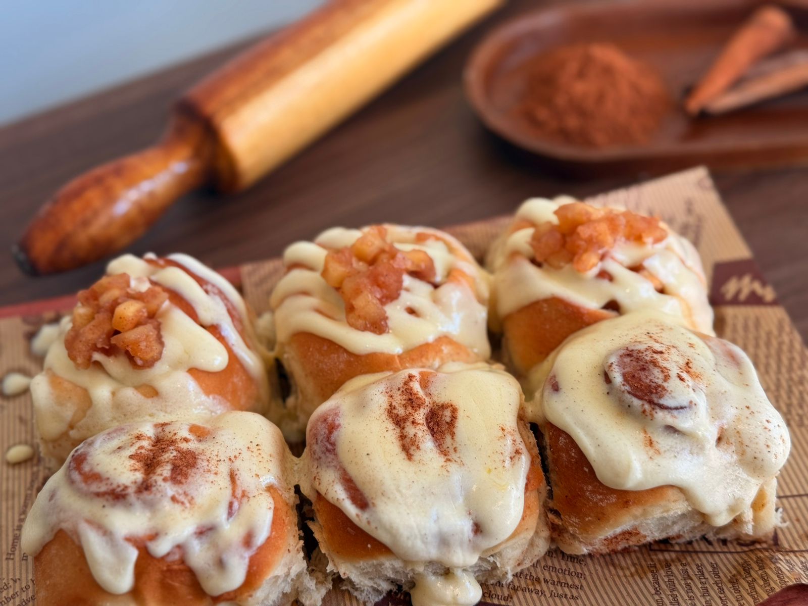 Sweet rolls with apple, cinnamon sugar, and cream cheese frosting.