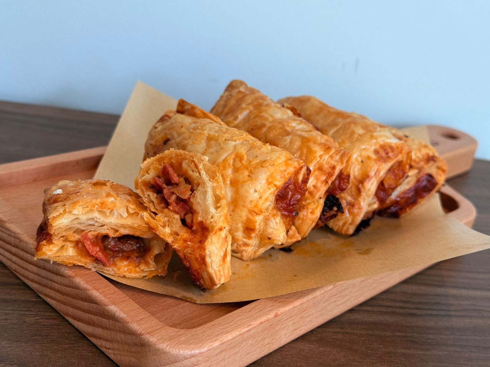 Flaky puff pastries filled with tomato, cheese, and herbs.