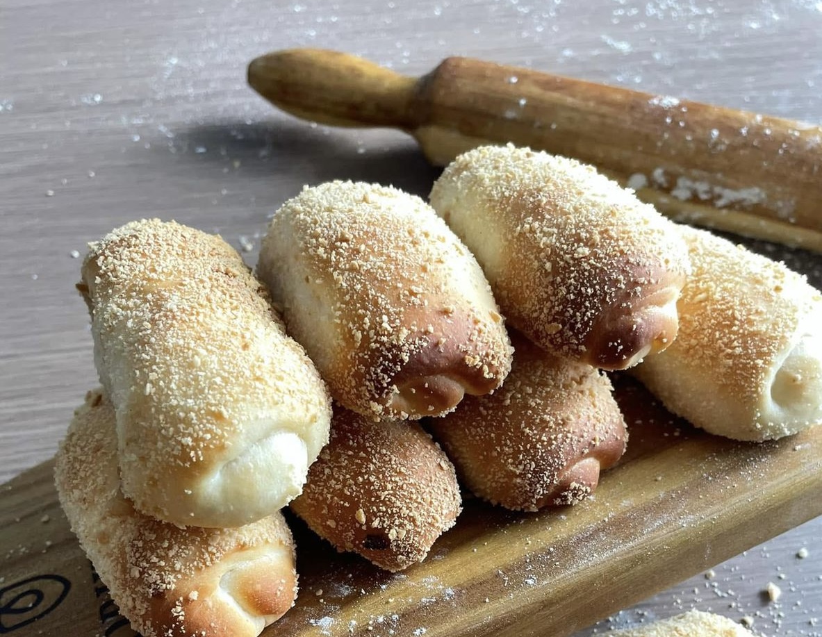 Filipino bread rolls with a sweet filling of breadcrumbs, condensed milk, and sugar.