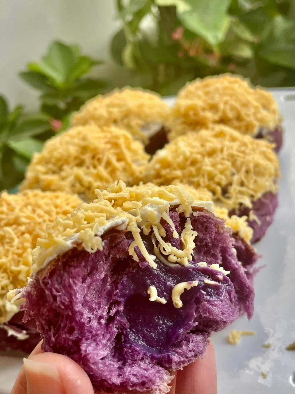 Filipino sweet buns with ube, cream cheese frosting, and grated cheddar cheese.