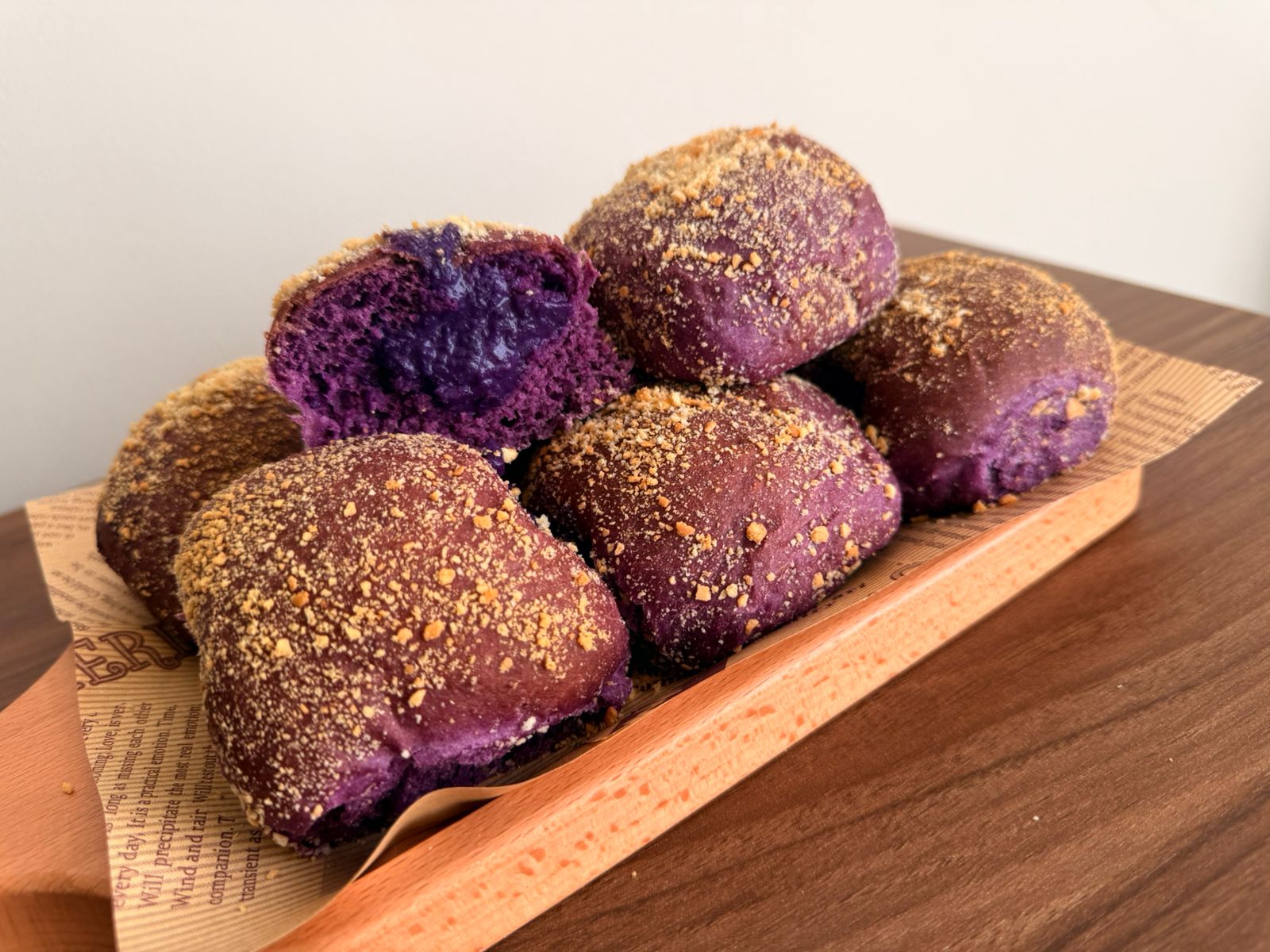 Soft Filipino pandesal bread rolls made with ube (purple yam) and filled with creamy ube jam.
