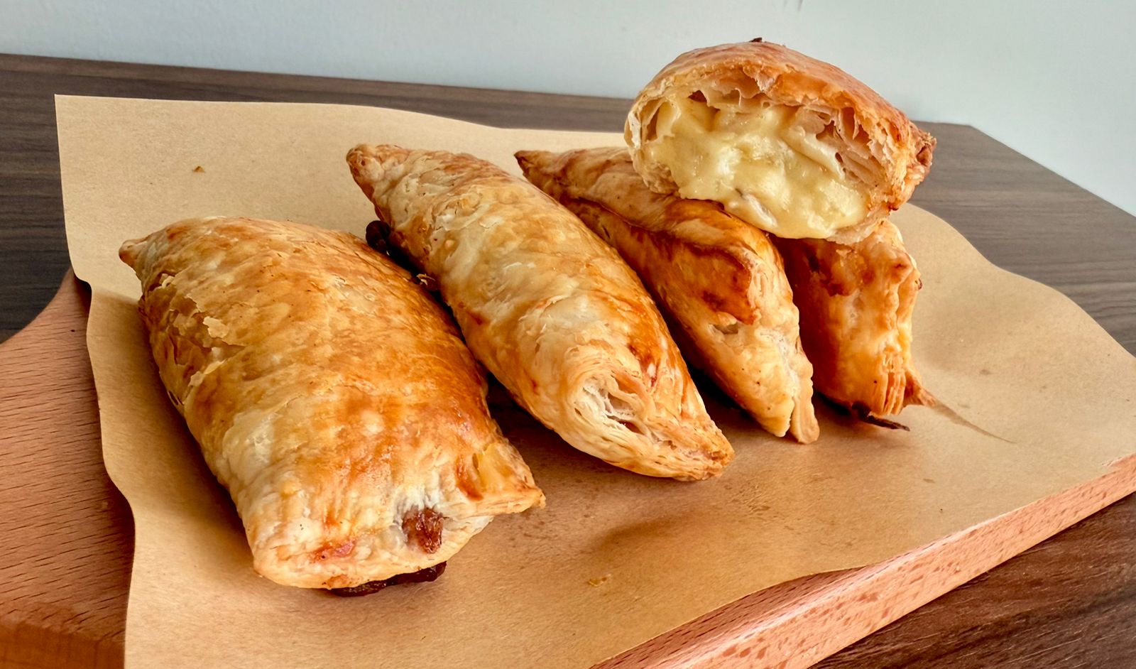 Puff pastries filled with melted cheese, onion, and potato.