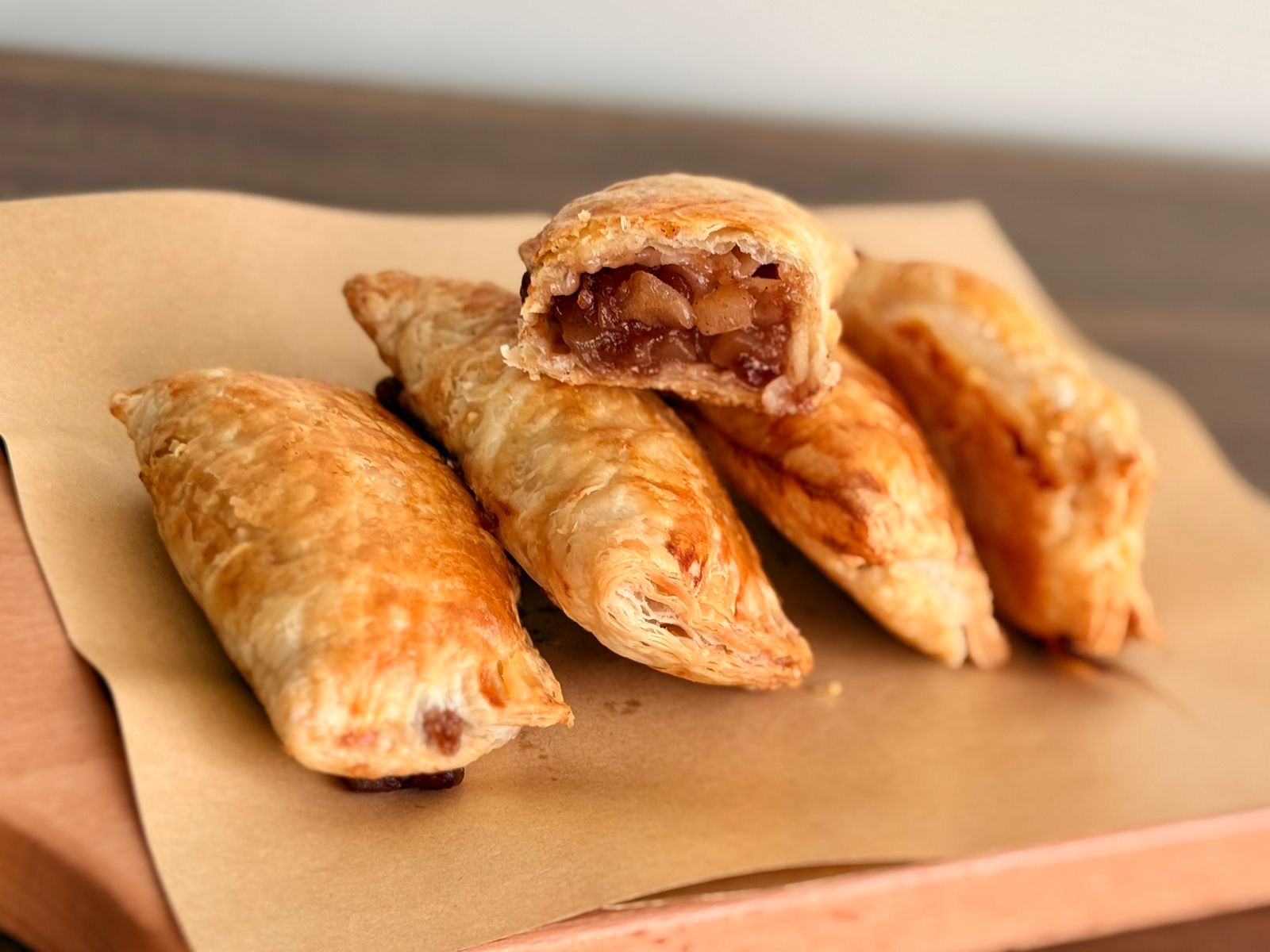 Golden apple puff pastries with flaky crust and cinnamon-apple filling