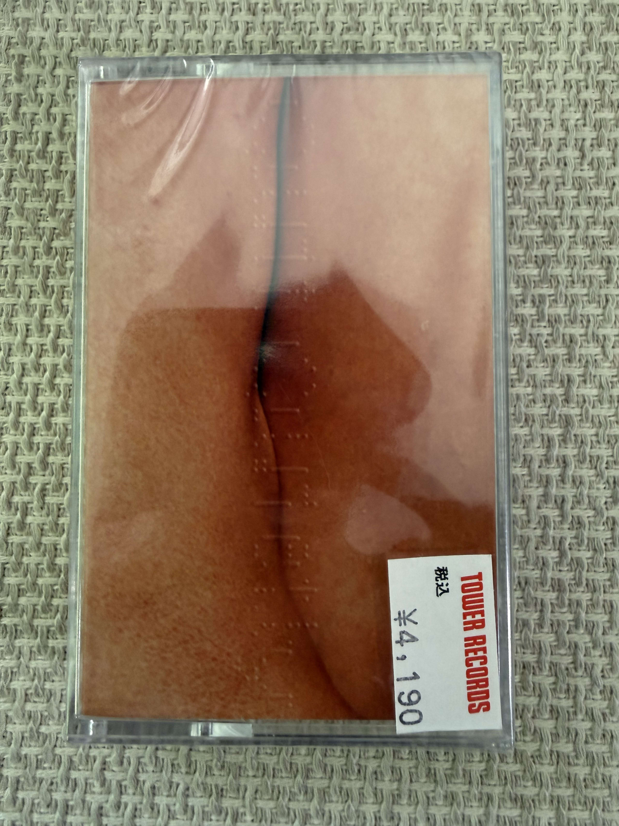 タワレコ値札付きのSunset Rollercoasterカセットテープ。