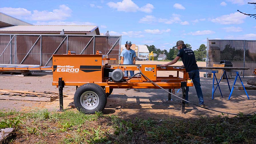 Student edging with a sawmill edger