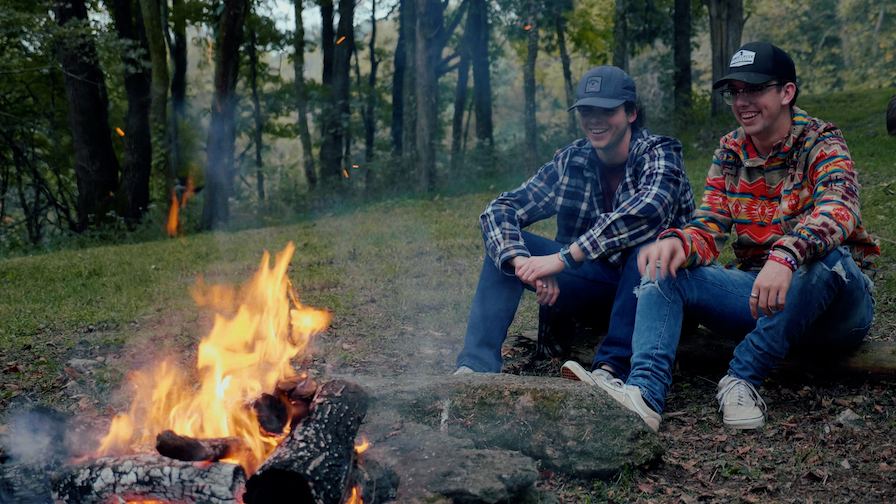 Students Sitting Around the Fire 