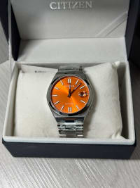 Reloj Citizen Tsuyosa Dial Naranja NJ0151-53Z, original con garantía