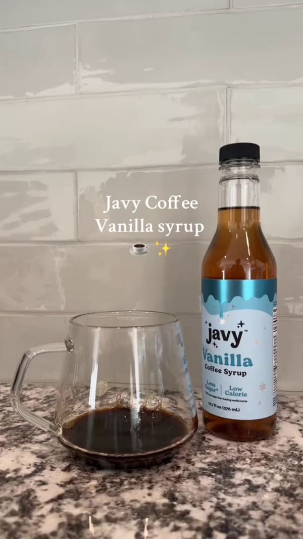 Customer making a coffee with Javvy Syrup