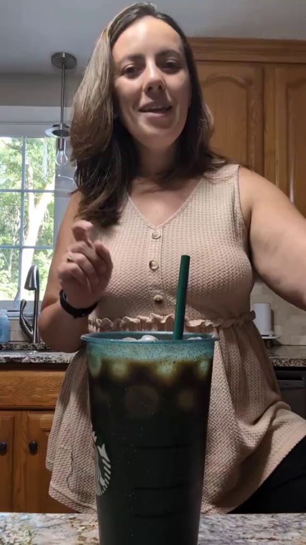Customer making a coffee with Javvy Syrup