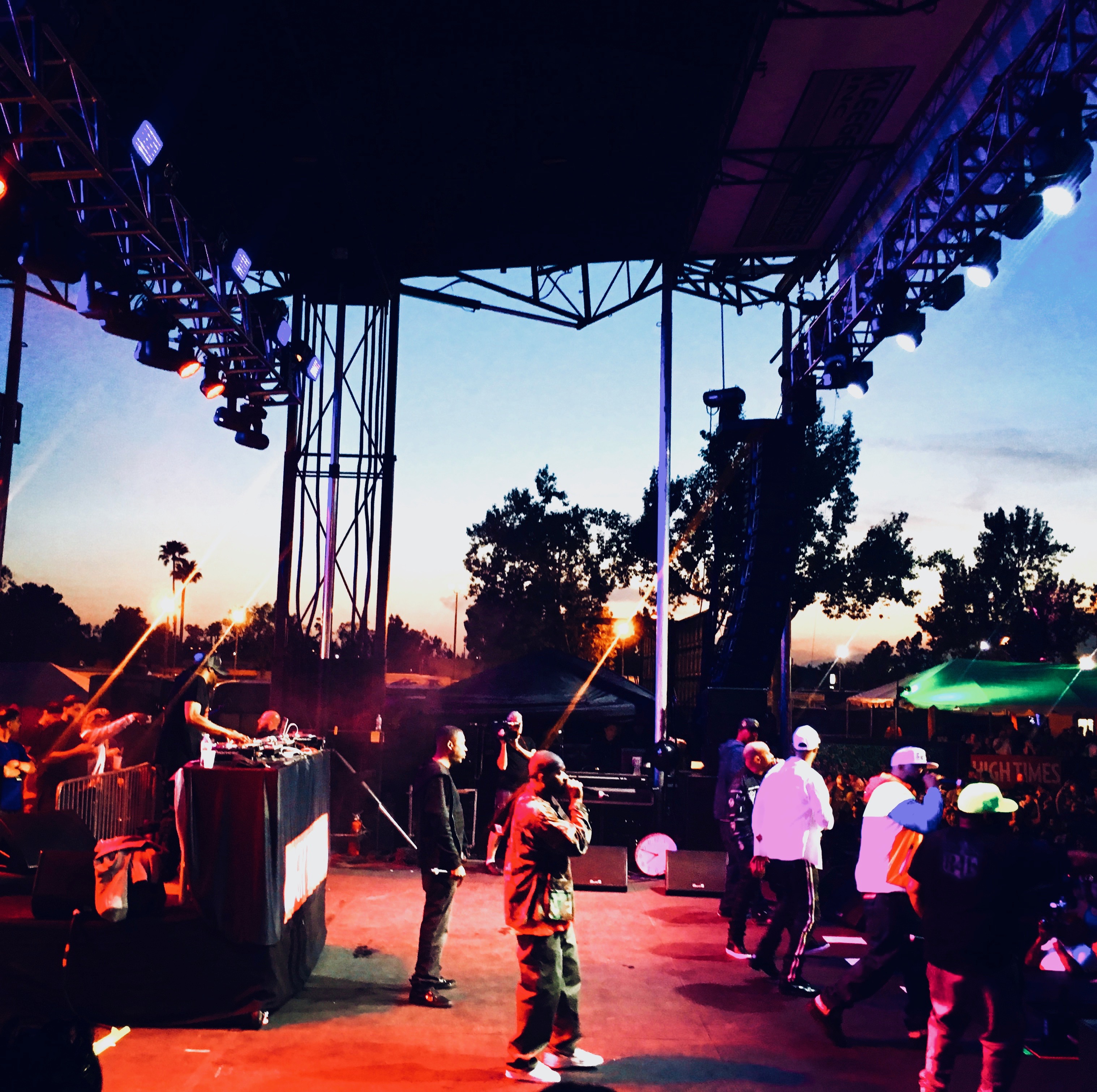 Concert stage at sunset with dramatic sky
