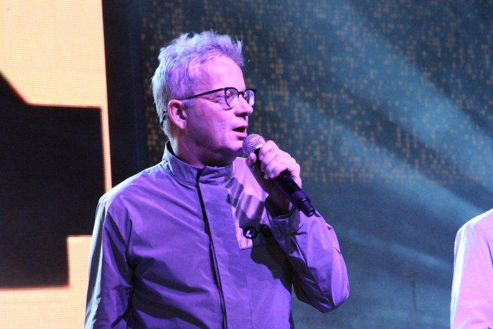 Devo frontman at Heaven Gala with red stage lighting