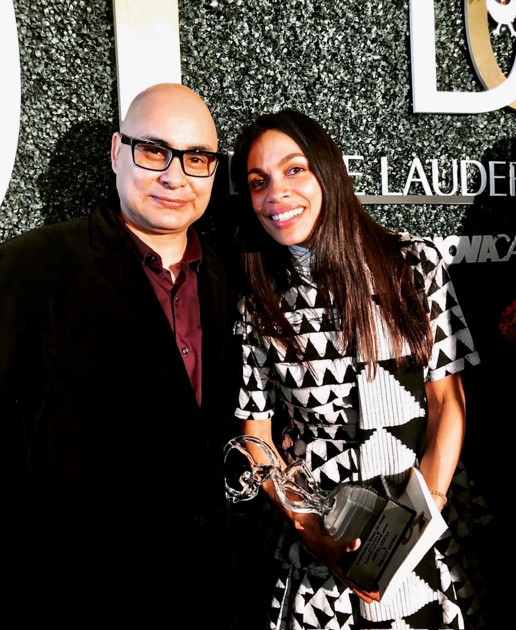 Carlos Azucena with Rosario Dawson at Estée Lauder event