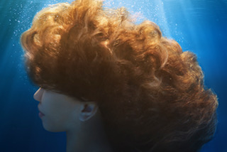 Underwater portrait with red hair — special effects photography