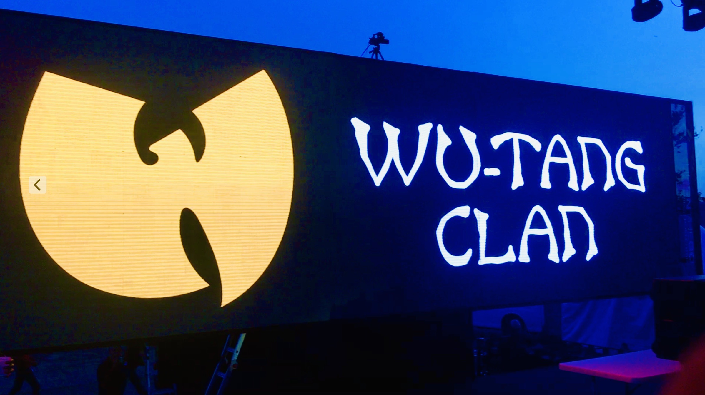 Wu-Tang Clan logo illuminated on stage