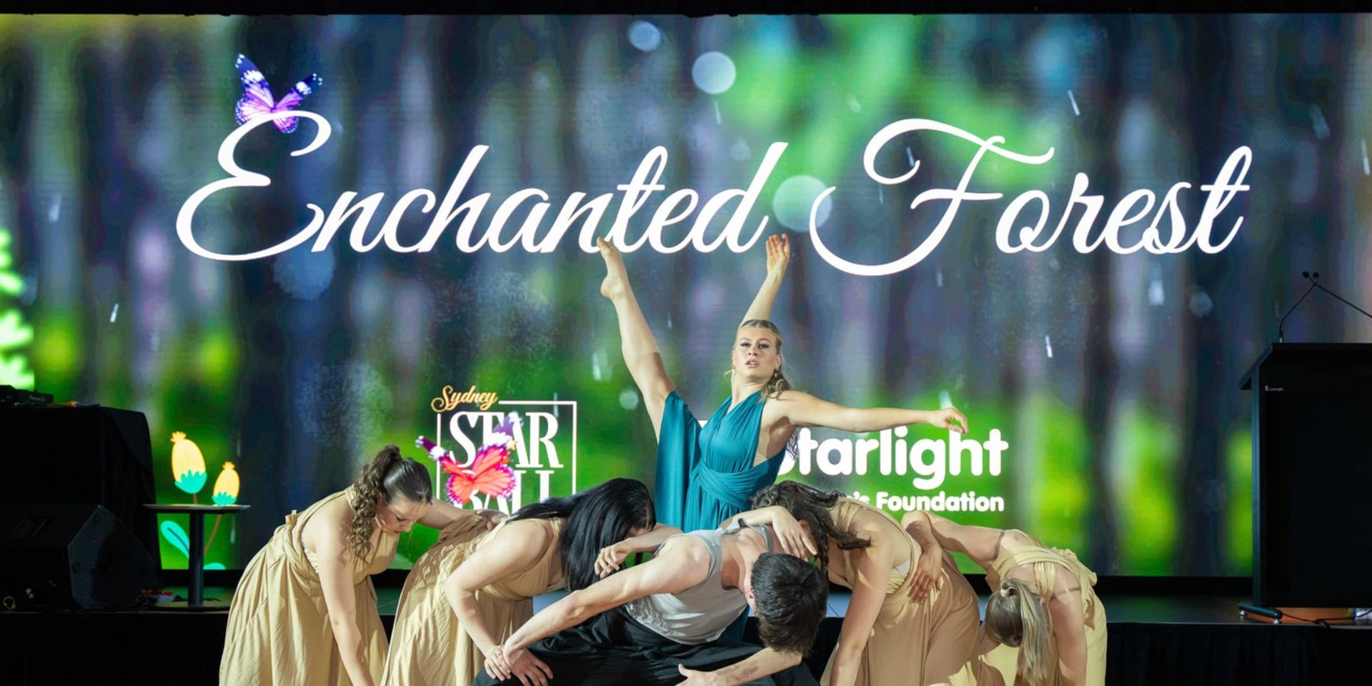 Contemporary dancers performing in front of the Enchanted Forest LED screen at the Sydney Star Ball
