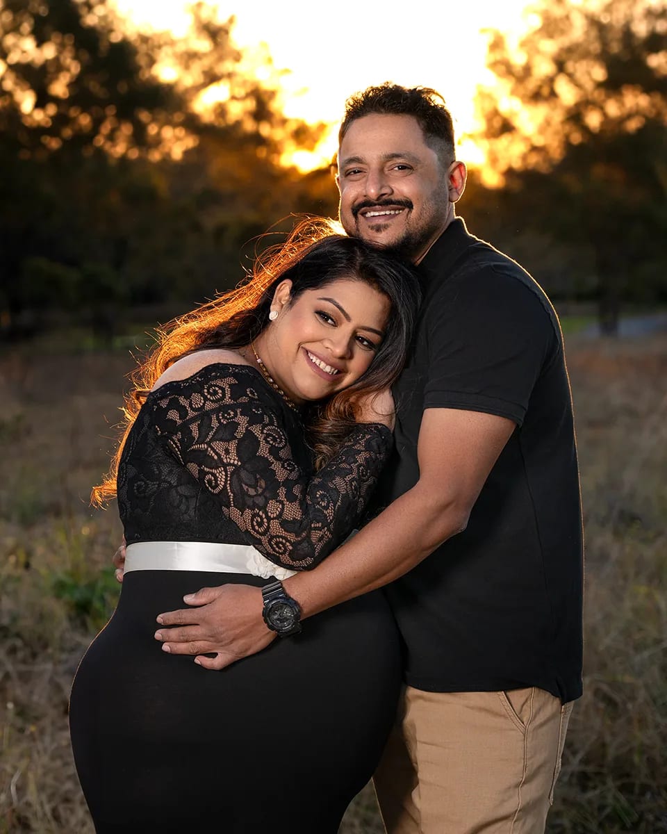 Maternity couple black lace dress golden sunset field — Shekhar Jay Photography